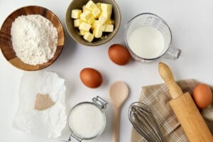 photo of a white kitchen counter with bowls of baking ingredients